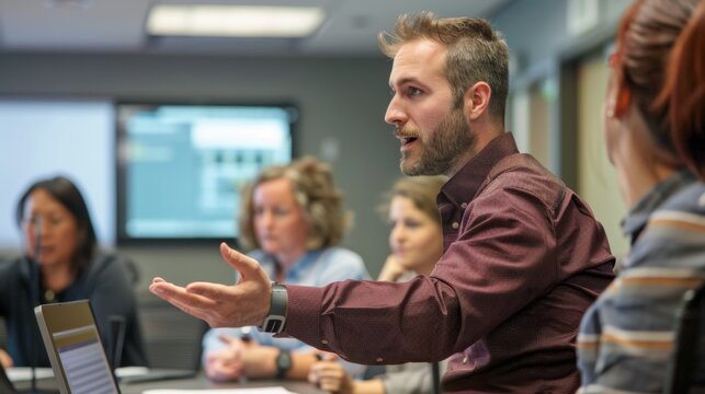 A young professional facilitates an interactive training session in a corporate office, demonstrating effective communication and engagement techniques.