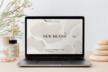 Laptop screen with online shop website, aesthetic workspace