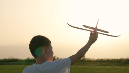 boy son child running airplane game flight dream playground green field sunset pilot, playful pilot...