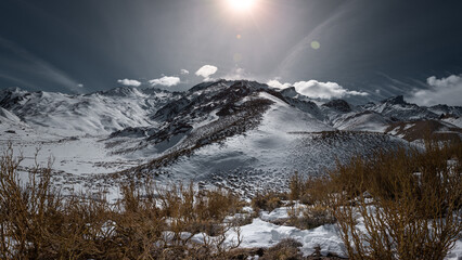 Panoramic of the snowy mountain with sunset.