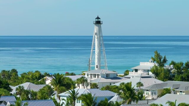 American waterfront houses and white lighthouse in island small town Boca Grande on Gasparilla Island in southwest Florida