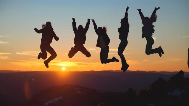 Silhouettes of four friends jumping mid-air on a mountaintop at sunset, sky ablaze with warm colors, long shadows cast over vast landscape, evoking freedom, adventure, and shared accomplishment.
