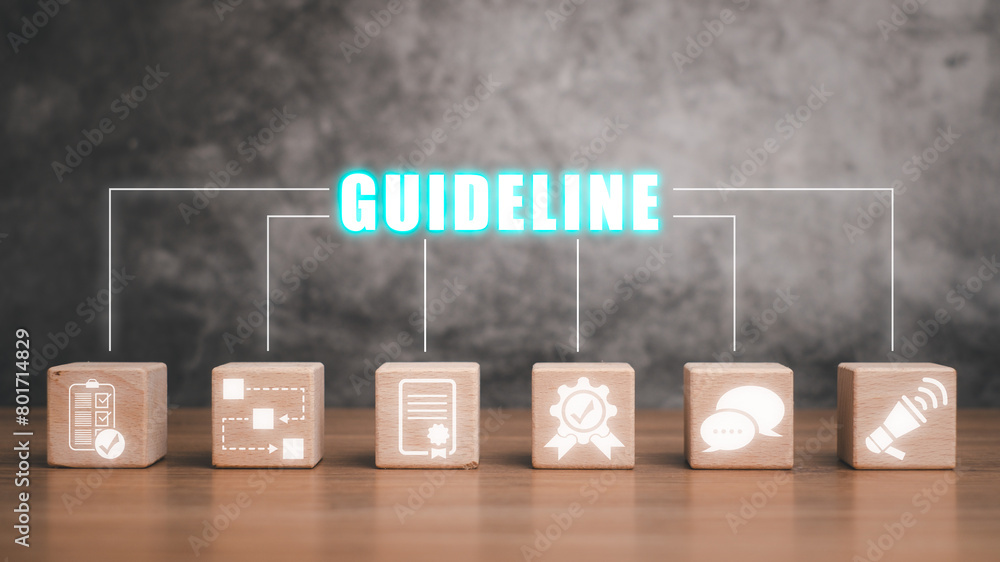 Poster guideline concept, wooden block on desk with guideline icon on virtual screen.