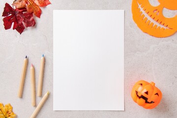 Halloween workspace flat lay with paper