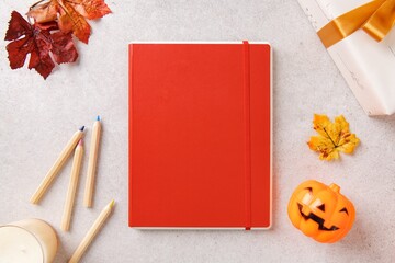 Halloween workspace flat lay with notebook