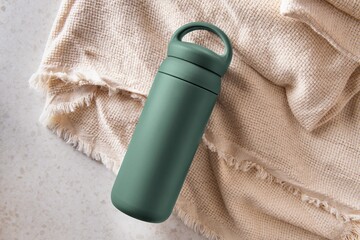 Green thermal water bottle, product with blank design space
