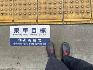 Feet waiting for the train