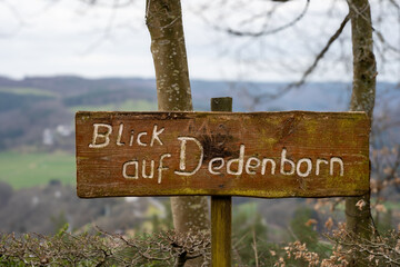 a wooden sign that says 