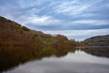 a lake with a large body of water with a cloudy sky in the background Germany EinRuhr