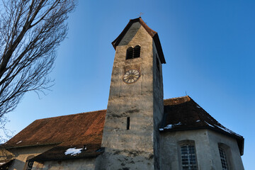 Fototapeta premium A large clock tower with a red roof and a white clock face