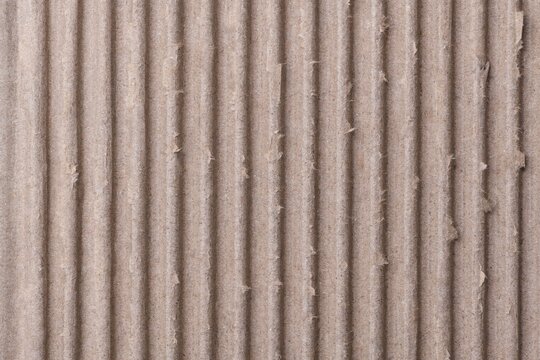 Corrugated paper texture, brown background