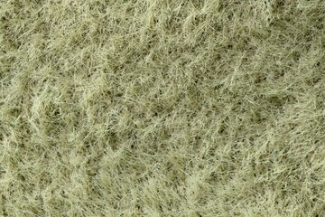 Green fabric texture background, macro shot