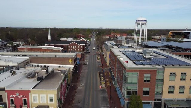 drone approaching Bentonville in Arkansas with the main tower and road 