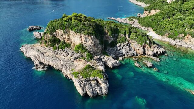 Limni beach glyko on corfu island, lush greenery atop rugged cliffs against the ionic sea, aerial view