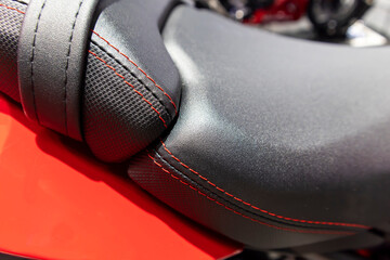 view of a leather motorcycle. macro picture. ,natural suede leather background with an abstract...