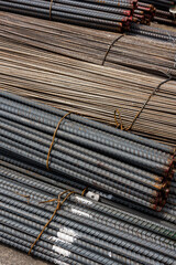 Detailed image showing a close-up of rusted steel reinforcement bars, commonly used in building construction for added strength. Delivered at the port.