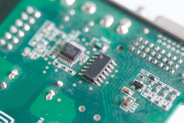 Close up of microchips on  green pcb board. 