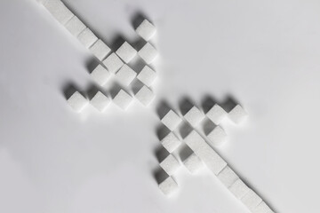 Sugar cube arrows meet each other, choices and journeys.