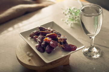 Dates and pure drinking water is consume to end Ramadan fast. Breaking Ramadan fast at Iftar.