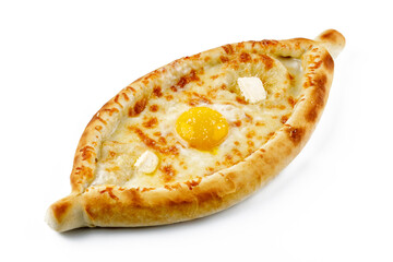 traditional Georgian dish of cheese-filled bread - khachapuri in adjarian style with egg and butter isolated on white background