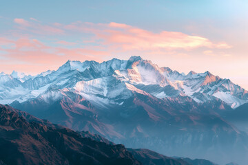 Majestic mountain range with snow peaks during sunrise, panoramic view