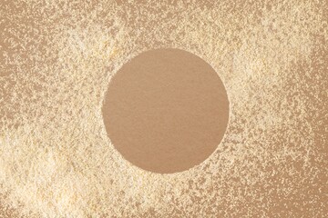 Beige powder texture frame, brown background