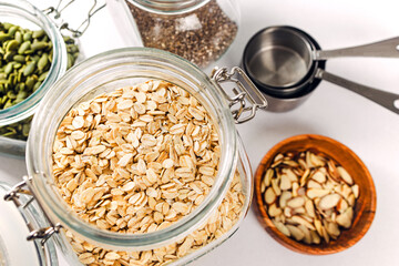 Glass jar full of rolled oats close-up, healthy nutrition