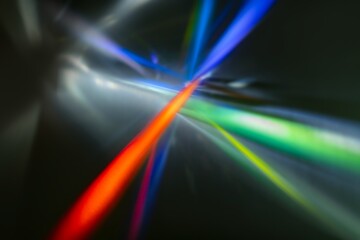 Neon lens flare prism rainbow light reflection on black background