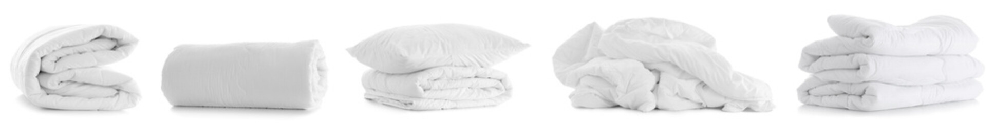 Set of soft blankets and pillow on white background