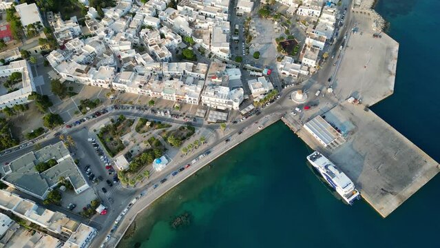 Aerial footage of the town and port of Parikia on the island of Paros, one of the many Cyclades Islands in the Aegean Sea.