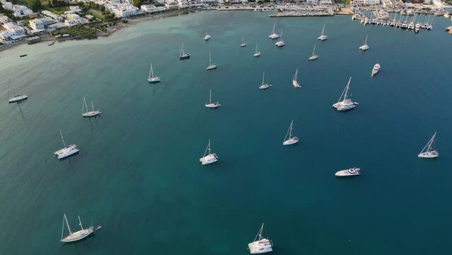 Aerial footage of the town and port of Parikia on the island of Paros, one of the many Cyclades Islands in the Aegean Sea.