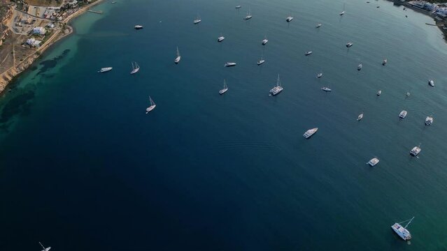 Aerial footage of the town and port of Parikia on the island of Paros, one of the many Cyclades Islands in the Aegean Sea.