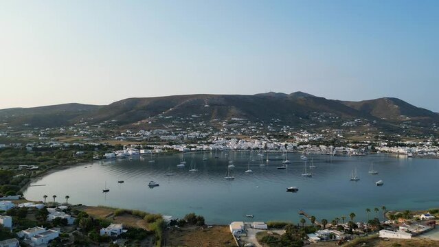 Aerial footage of the town and port of Parikia on the island of Paros, one of the many Cyclades Islands in the Aegean Sea.