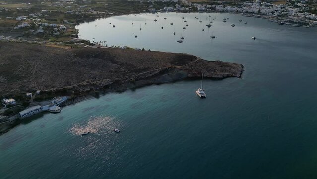 Aerial footage of the town and port of Parikia on the island of Paros, one of the many Cyclades Islands in the Aegean Sea.