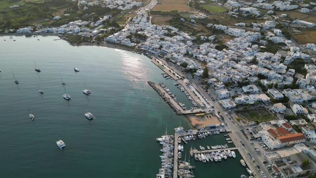 Aerial footage of the town and port of Parikia on the island of Paros, one of the many Cyclades Islands in the Aegean Sea.