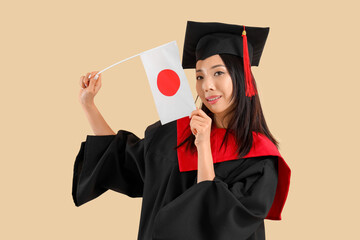 Female Asian graduate with flag of Japan on beige background