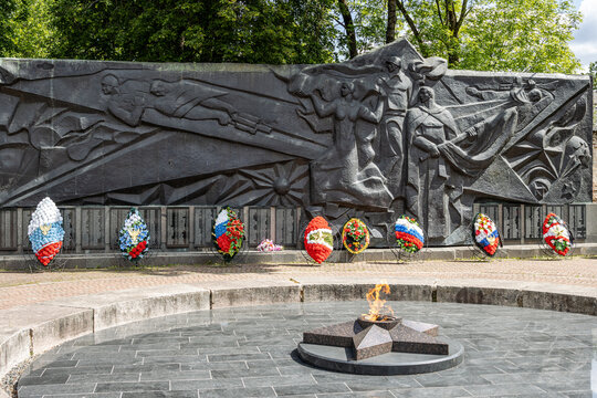 Valday town, Novgorod region, Russia - June 9, 2023. Memorial complex to the Valdai Soldiers who died as heroes during the Great Patriotic War (WWII). The eternal flame in front of the monument.
