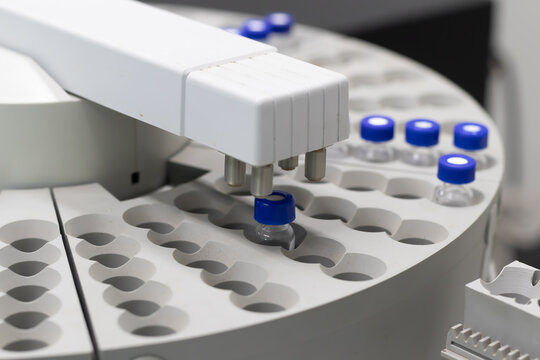Automated laboratory sample handling system with vials in gas chromatography autosampler carousel. Modern scientific research and pharmaceutical testing equipment for chemical analysis