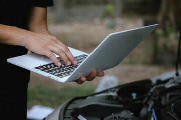Modern mechanics use laptop computers to check engines. Gather detailed information during work....