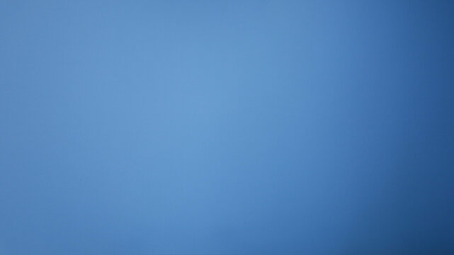 Light blue wall background. Abstract blue gradient wall for background work