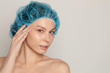 Woman in hairnet at beauty clinic