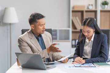 Asian businesswoman and businessman facing workplace challenges. From age diversity to handling...