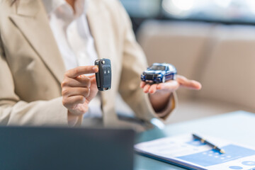 Experienced Asian businesswoman adept in car insurance processes. Skilled in handling claims, negotiating deductibles, and providing comprehensive coverage advice for clients' needs.