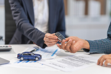 Asian businesswoman specializing in car loan services. Proficient in terms like extended warranty,...