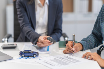 Asian businesswoman specializing in car loan services. Proficient in terms like extended warranty, lease, MSRP, and navigating financing options for customers' automotive needs.