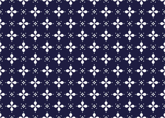White symbol flowers form on dark blue background, ethnic fabric seamless pattern design for cloth, carpet, batik, wallpaper, wrapping etc.