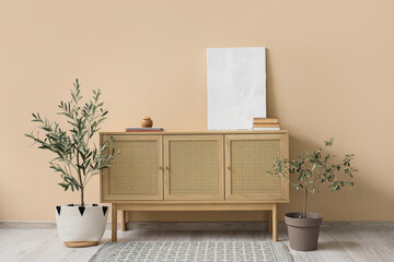 Interior of living room with painting on commode