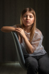 Obraz premium Studio portrait of a young beautiful long-haired girl.
