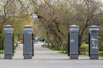The open gates of the city park on a spring day