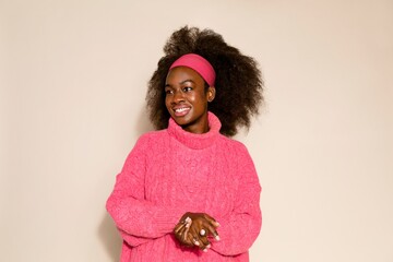 Black woman in pink knitted sweater